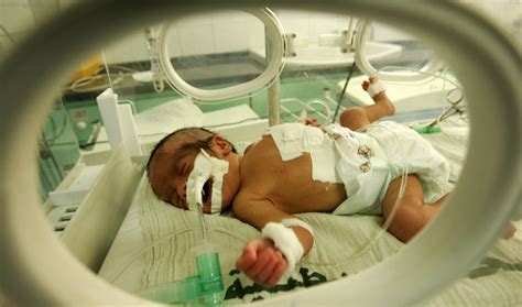 Newborn baby remains critical after being found outside .